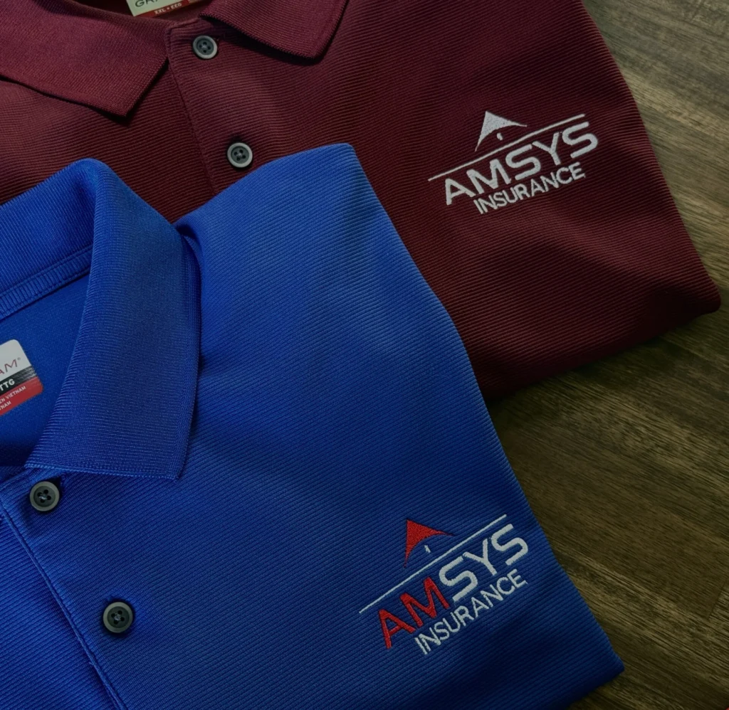 Maroon and blue polos with embroidered AMSYS Insurance logo
