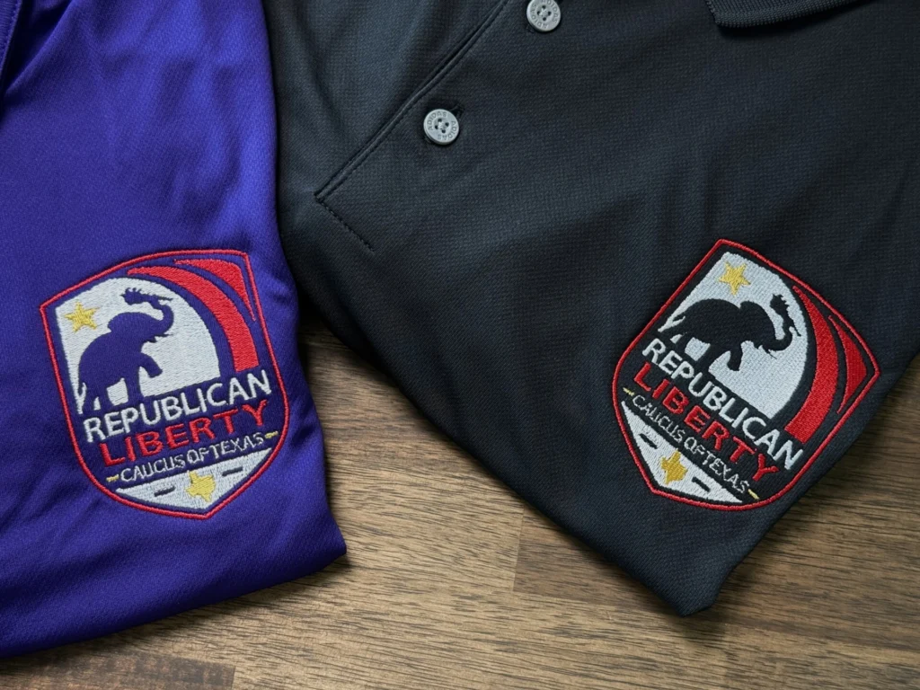 Purple and black polos with embroidered Republican Liberty Caucus of Texas badge logo